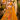 A woman models a bright yellow and orange printed lehenga choli with a matching dupatta in a decorative indoor set. An inset shows a closer view of the choli.