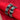 A pair of silver-toned bangles with rectangular black inlays, displayed on a red fabric roll. The image includes a yellow '$25' price overlay and a red patterned textile border on the left.